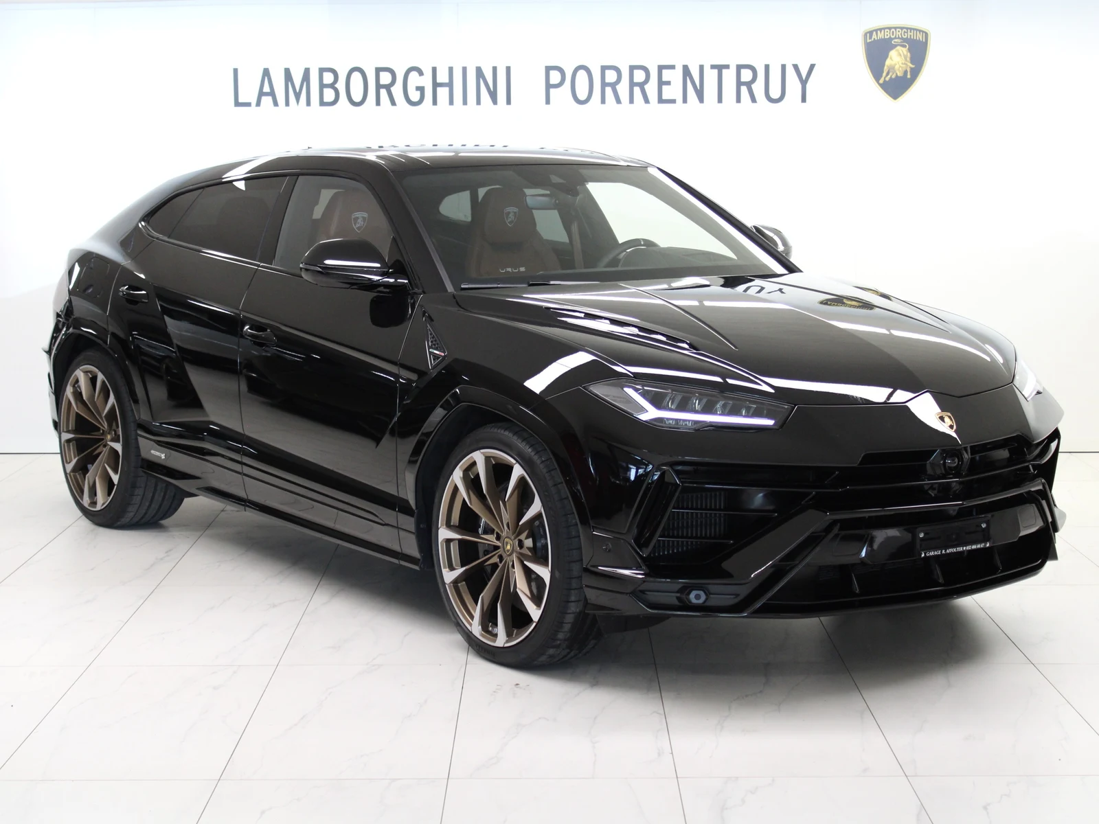 Black Lamborghini Urus S, full front three-quarter view
