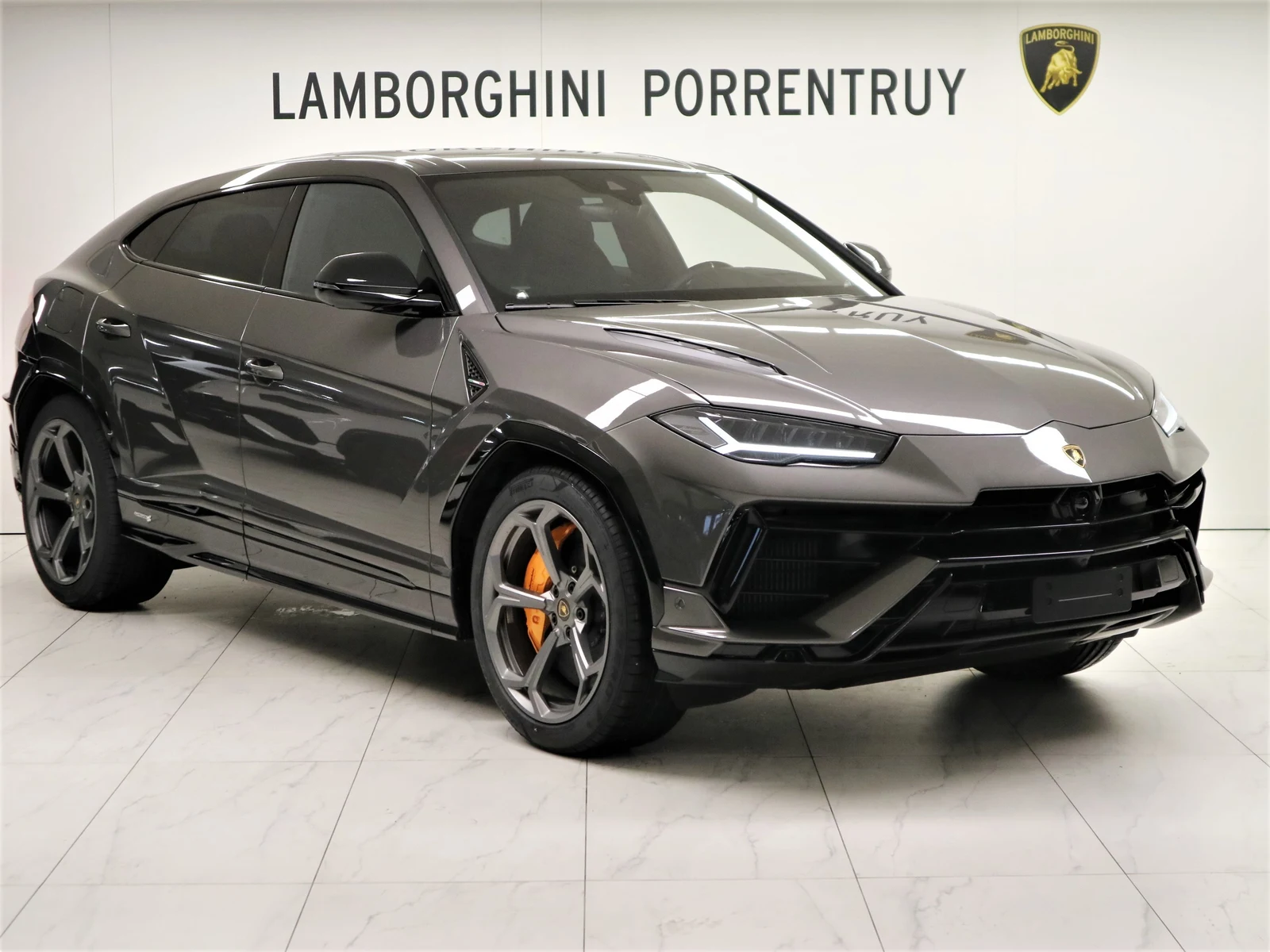 Anthracite gray Lamborghini Urus S, full front three-quarter view