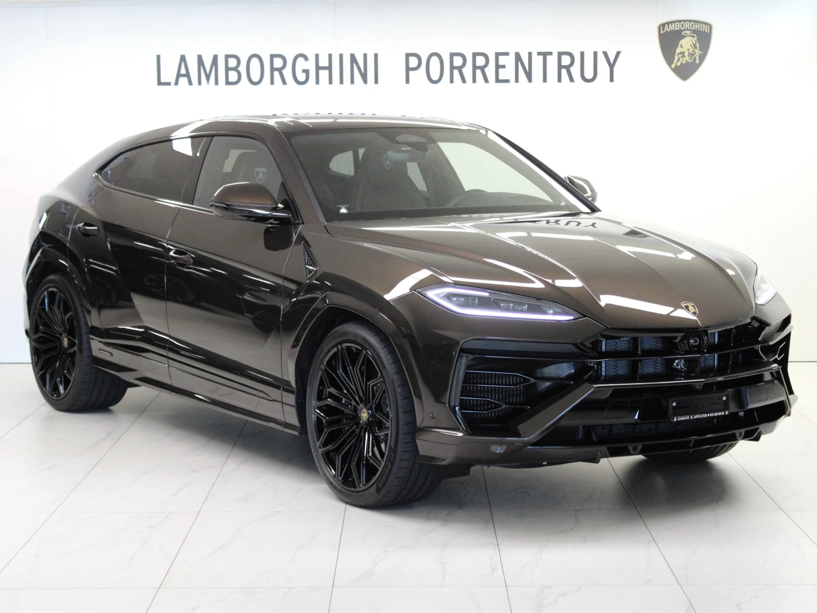 Brown Lamborghini Urus SE, full front three-quarter view
