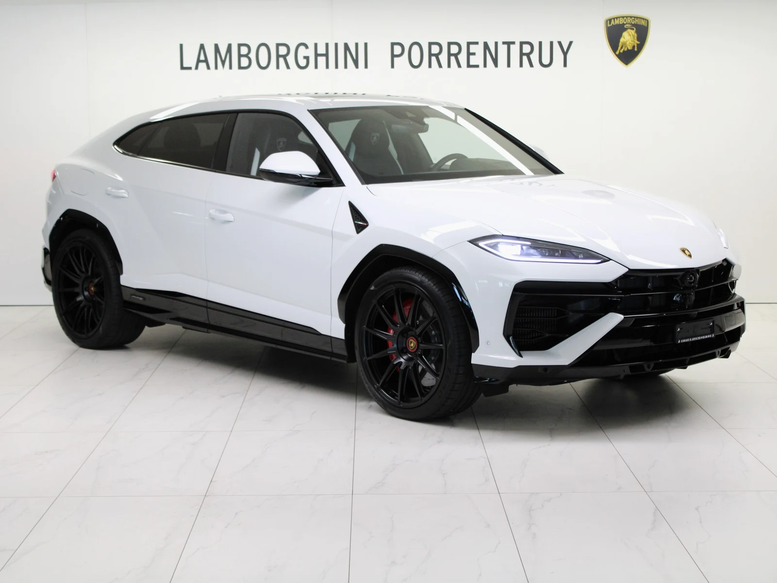 White Lamborghini Urus SE, full front three-quarter view