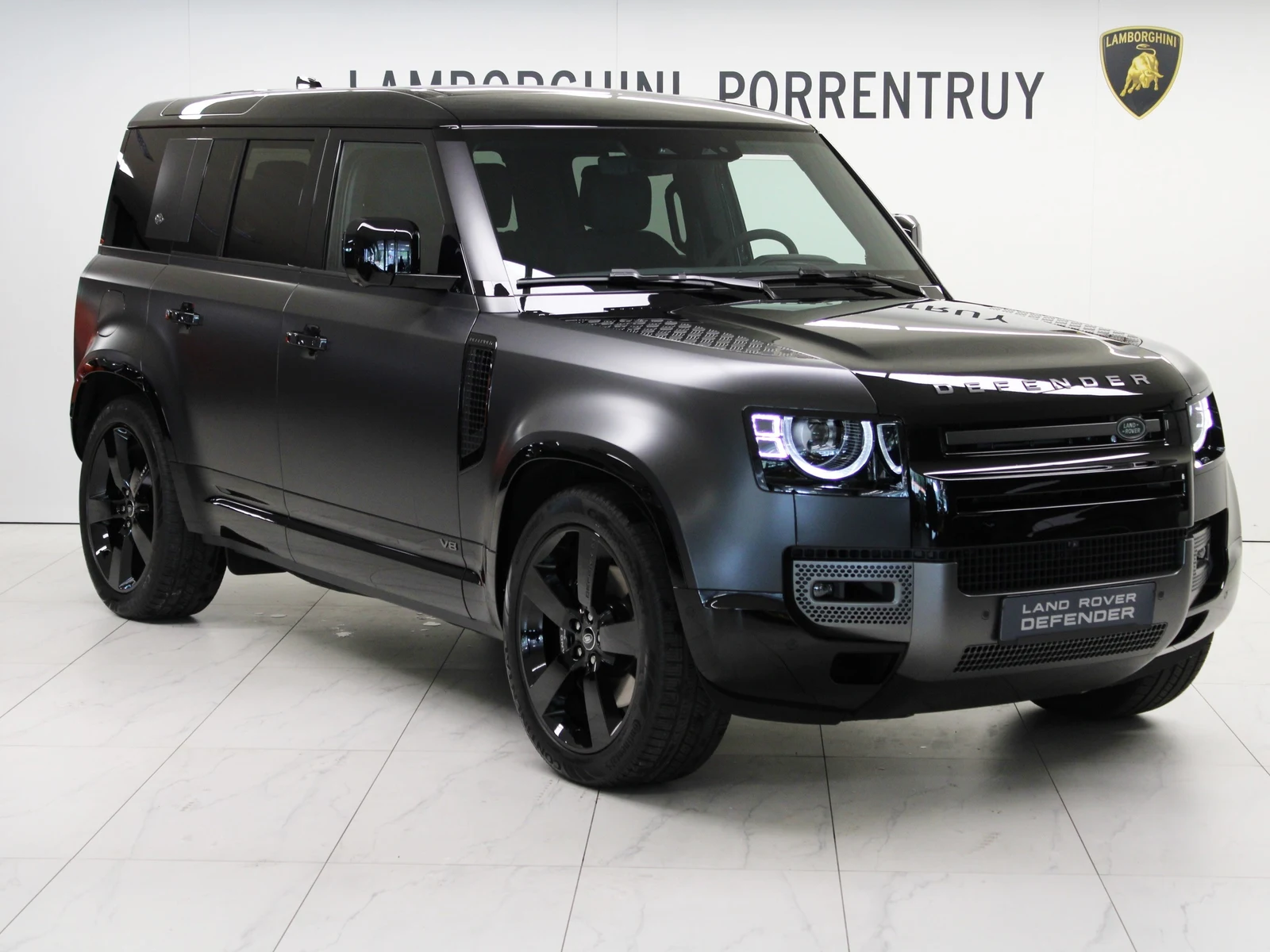 Anthracite gray Land Rover Defender 110 V8 Carpathian Edition, full front three-quarter view