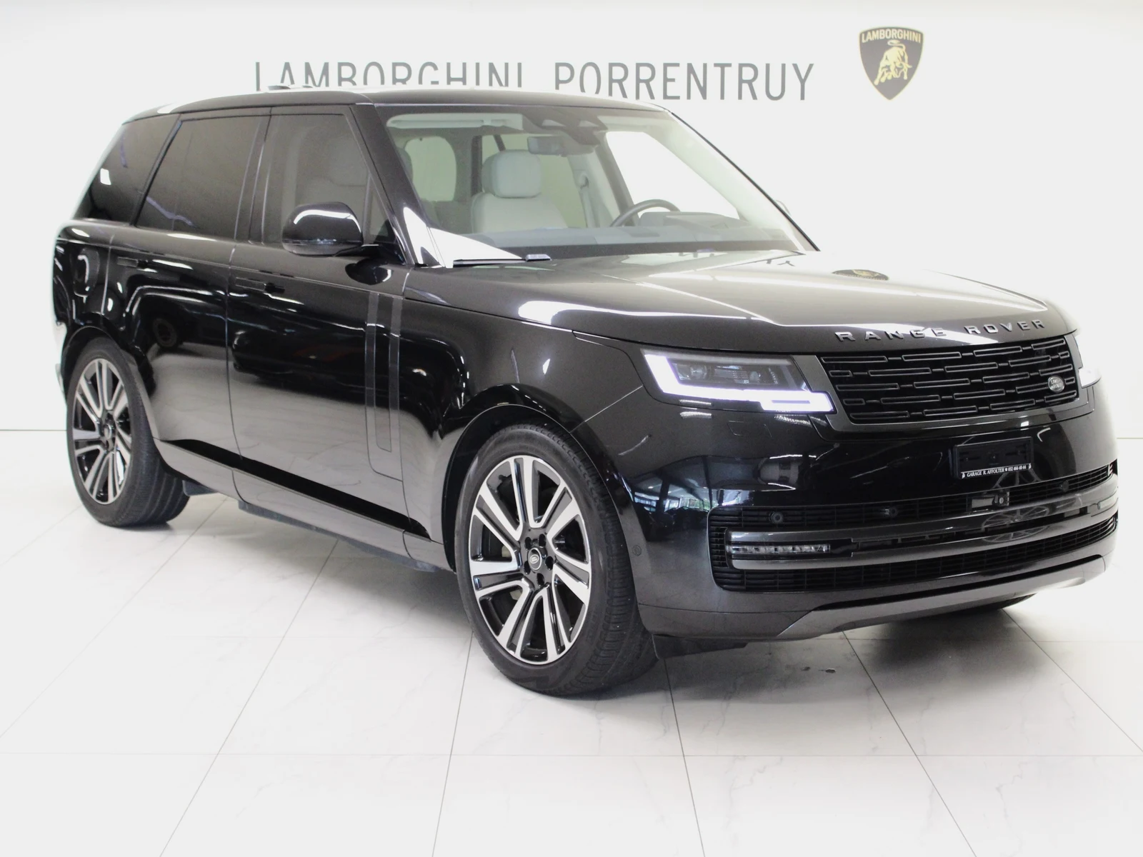 Black Land Rover Range Rover P440e HSE, full front three-quarter view