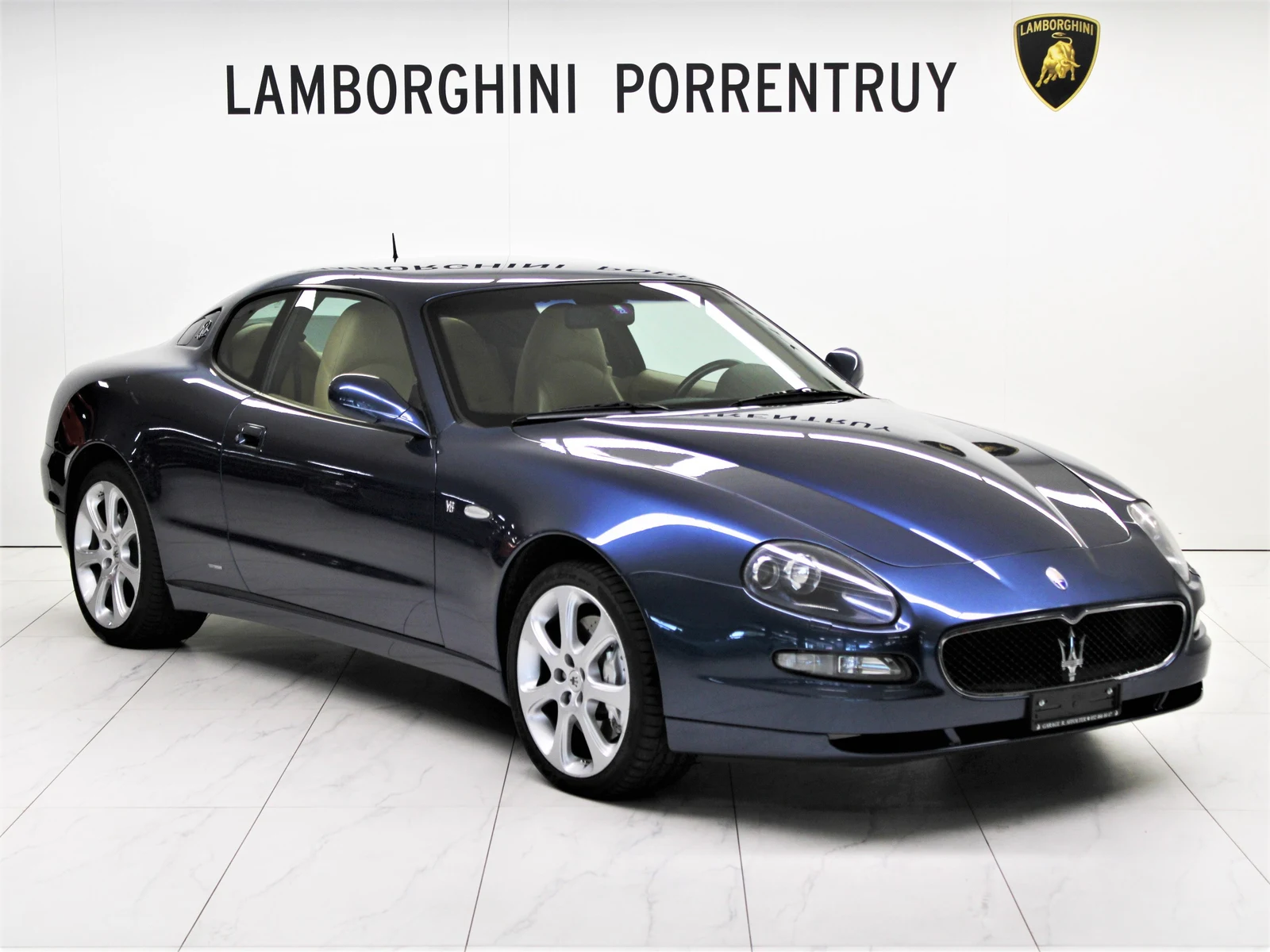 Blue Maserati Coupé GT, full front three-quarter view