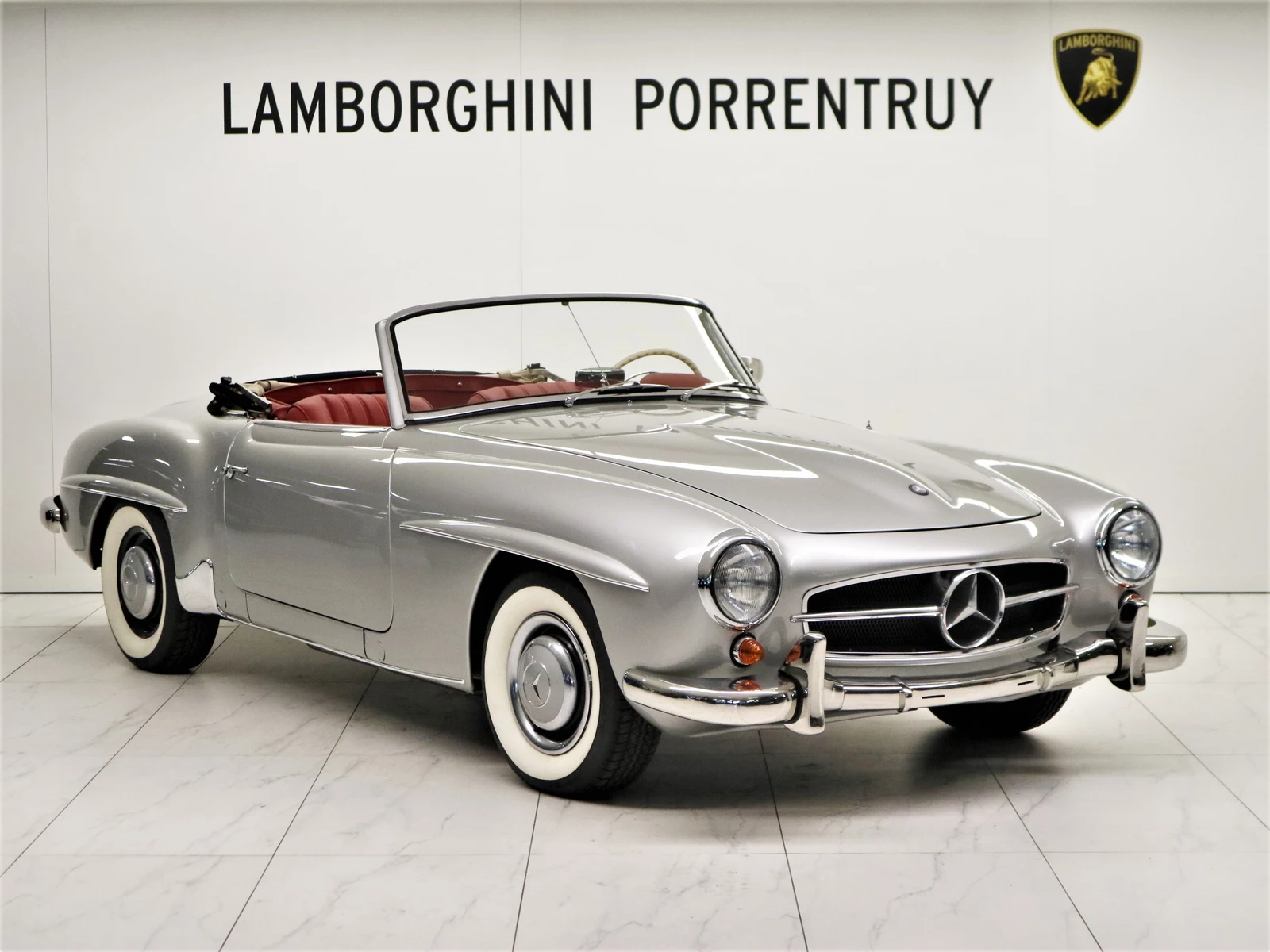Gray Mercedes-Benz 190 SL (W121), full front three-quarter view