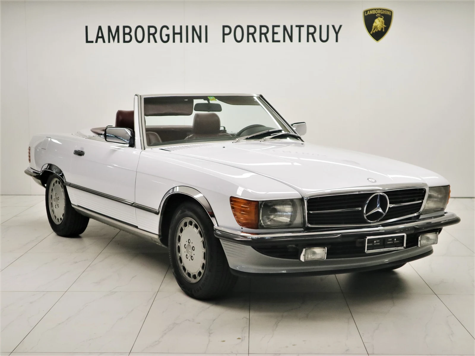 White Mercedes-Benz 300 SL (R107), full front three-quarter view