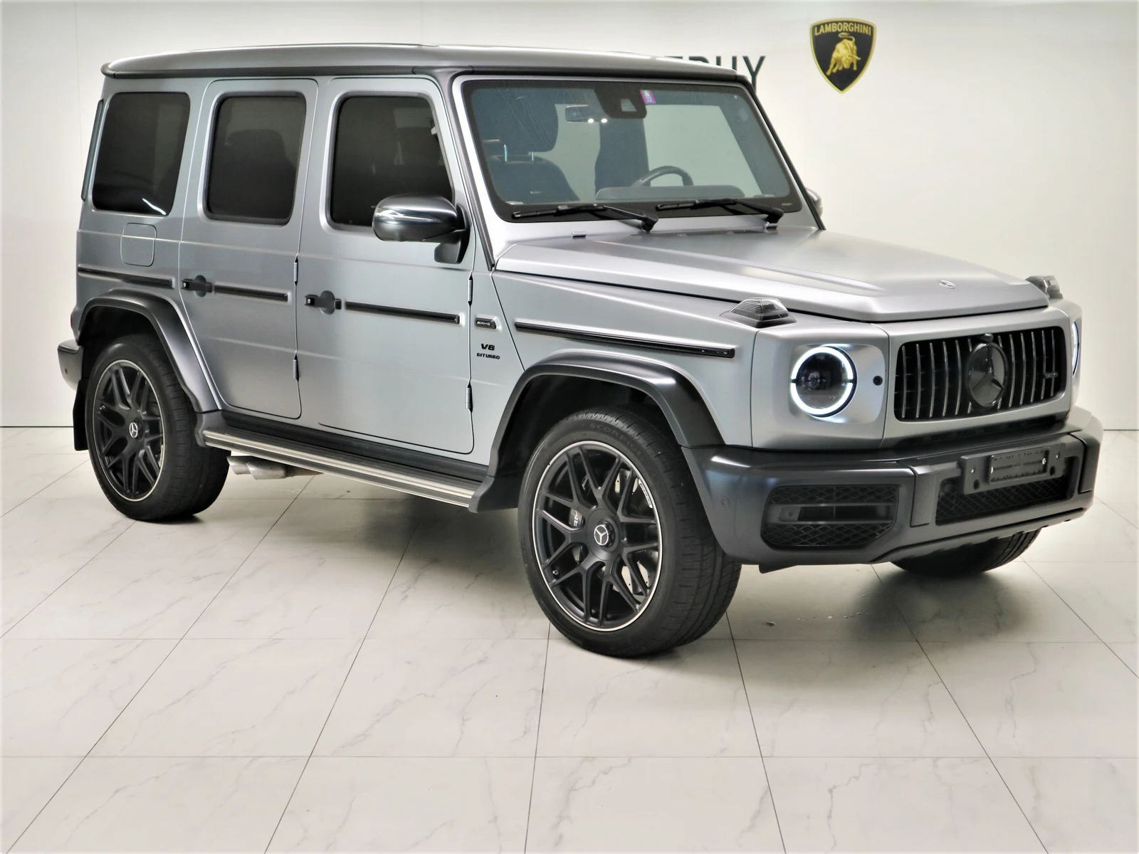 Gray Mercedes-AMG G 63 (W463A), full front three-quarter view