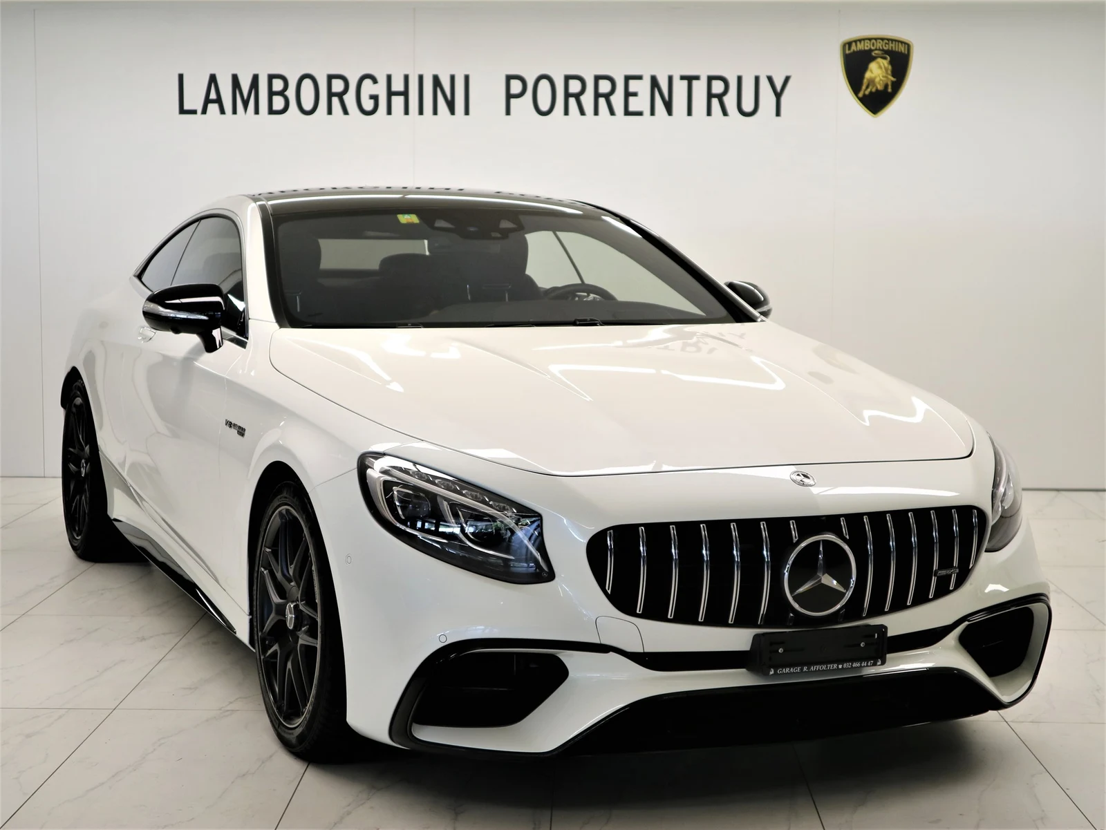 White Mercedes-AMG S 63 4MATIC+ Coupé (C217), full front three-quarter view