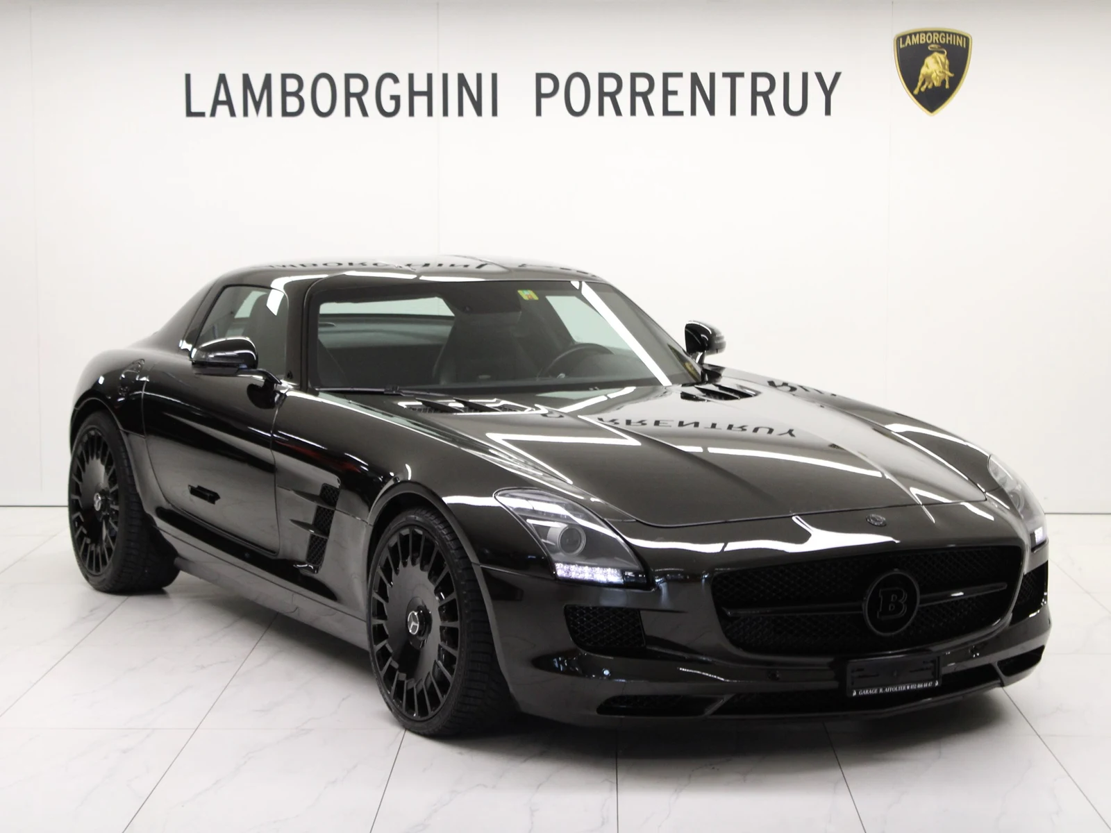 Black Mercedes-AMG SLS, full front three-quarter view