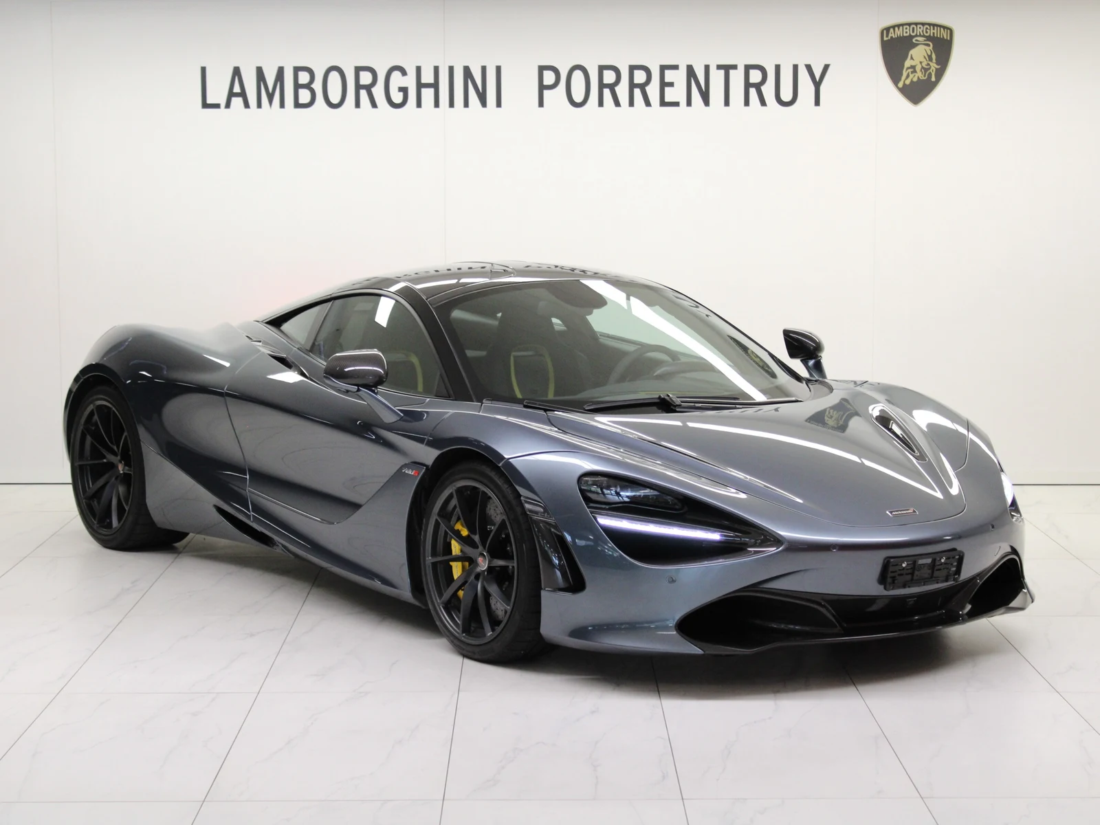 Anthracite gray McLaren 720S, full front three-quarter view