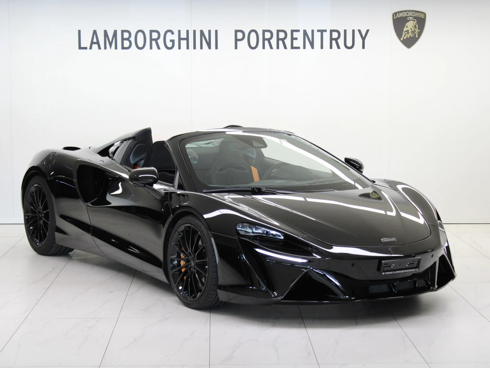 Black McLaren Artura Spider, full front three-quarter view