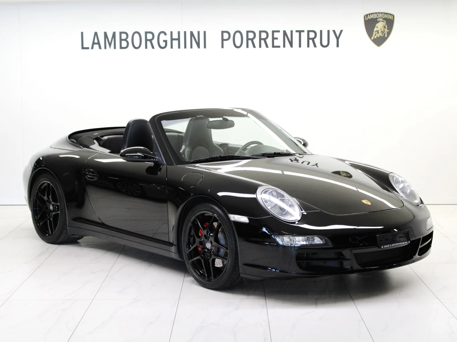 Black Porsche 911 Carrera 4S Cabriolet RUF Kompressor R (997), full front three-quarter view