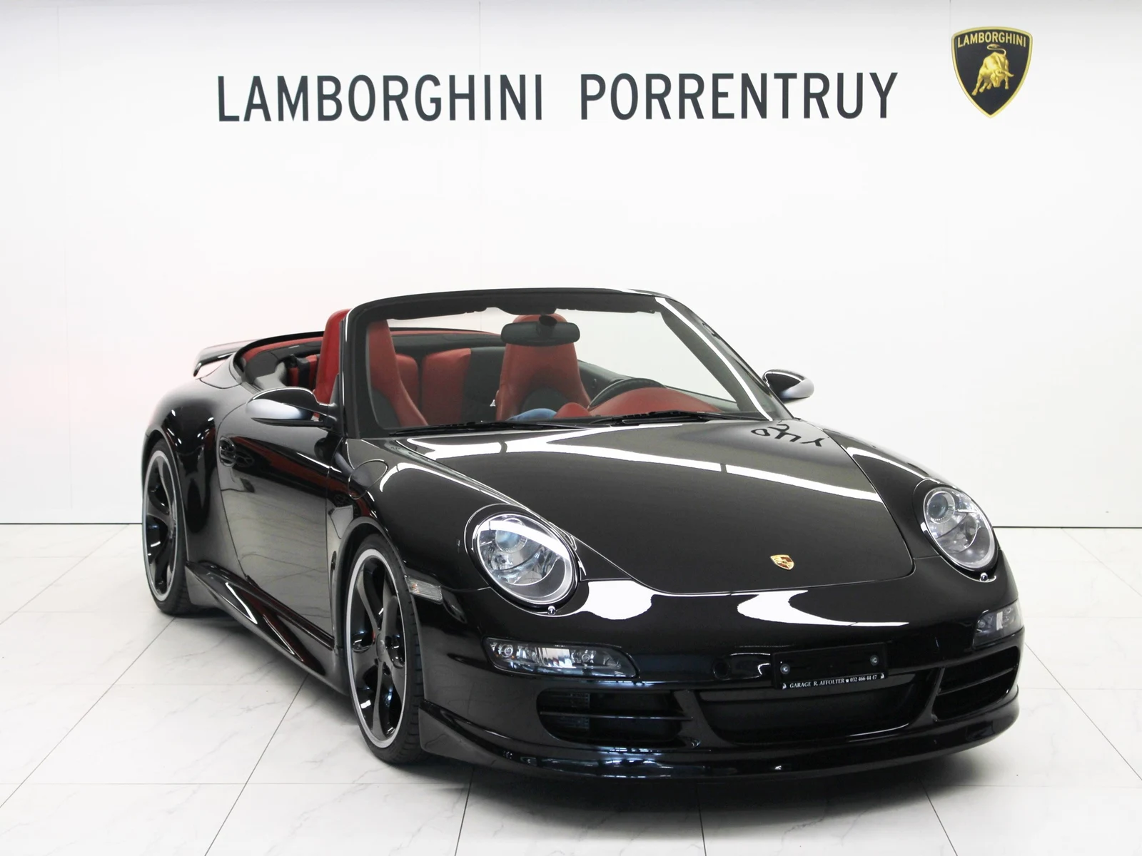 Black Porsche 911 Carrera 4S Cabriolet TECHART (997), full front three-quarter view