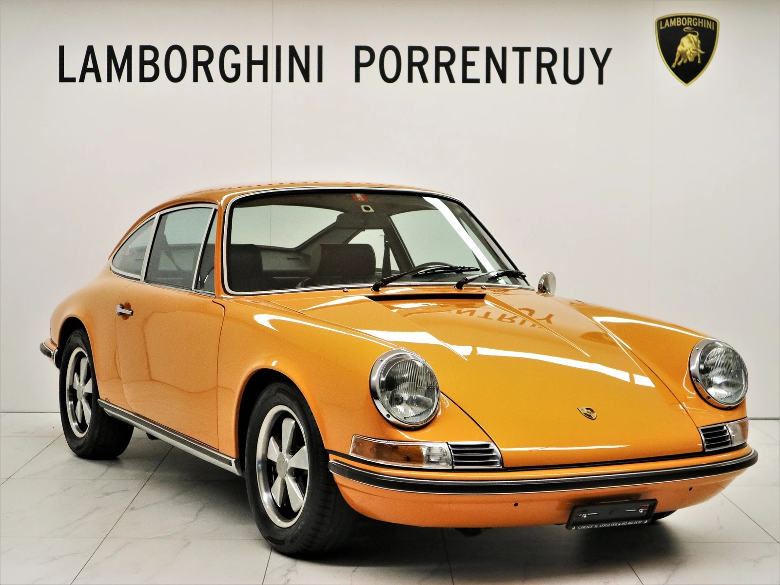 Orange Porsche 911 S 2.2, full front three-quarter view