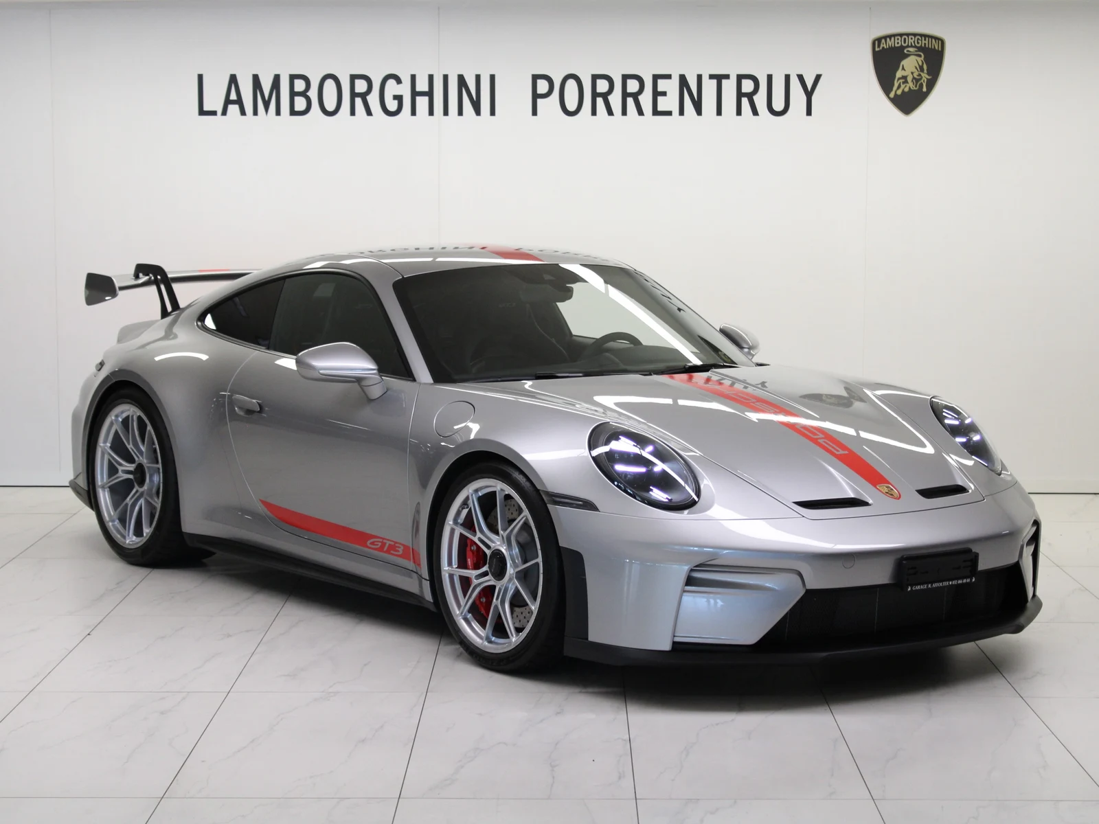 Silver Porsche 911 GT3 (992.2), full front three-quarter view