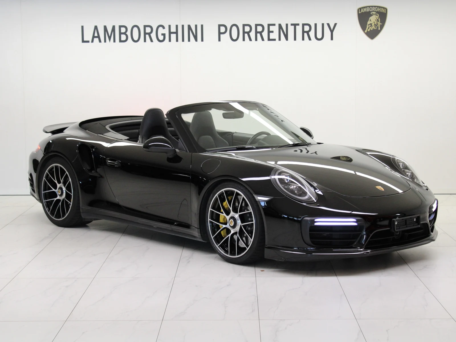 Black Porsche 911 Turbo S Cabriolet (991), full front three-quarter view