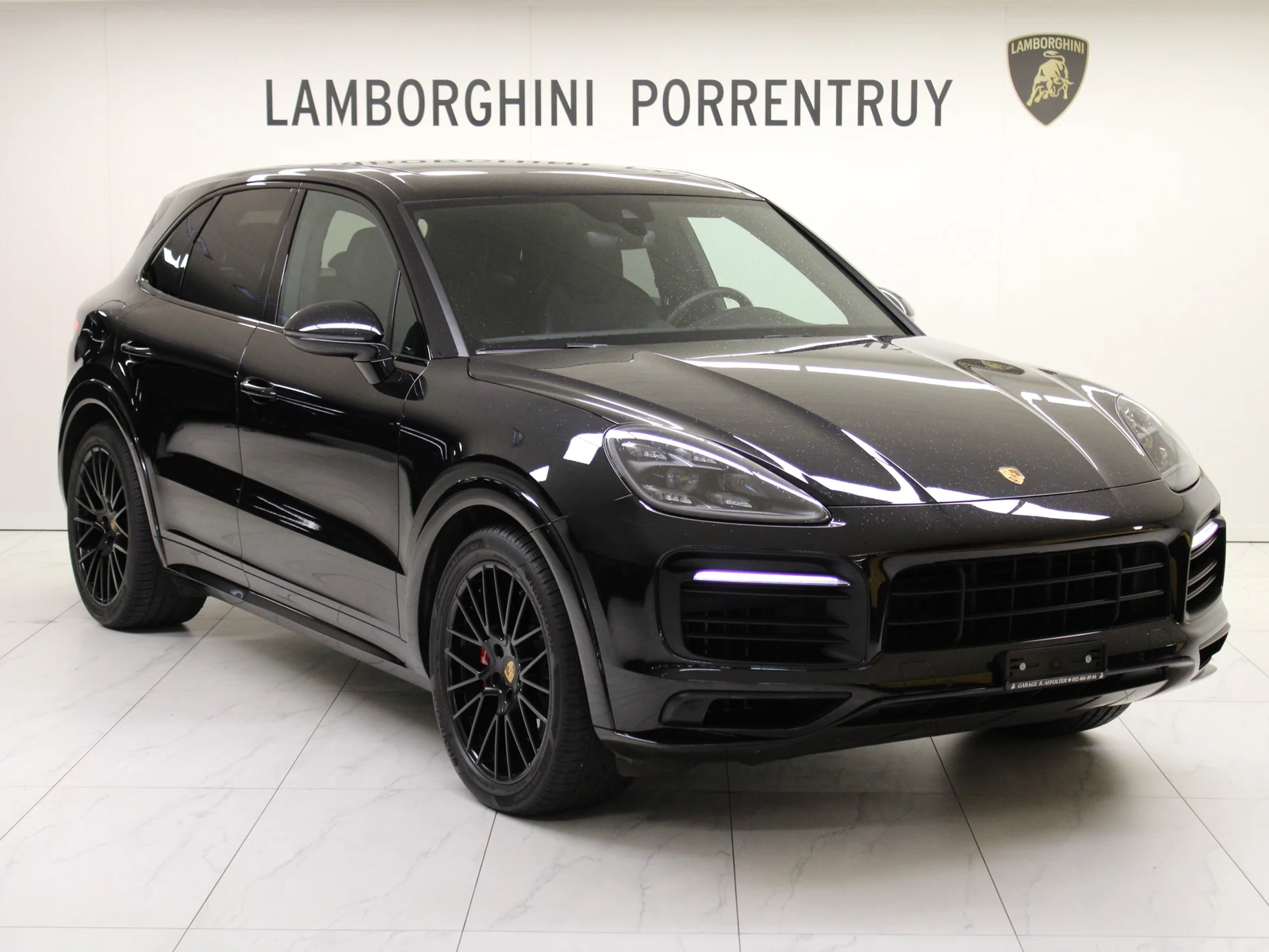 Black Porsche Cayenne GTS (E3), full front three-quarter view