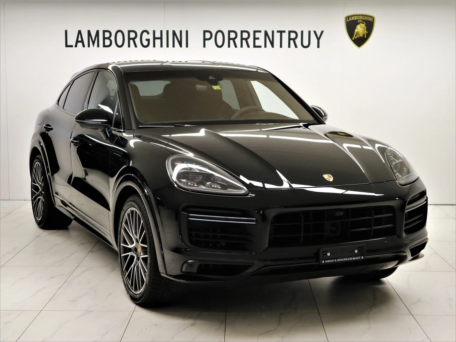 Black Porsche Cayenne Turbo Coupé, full front three-quarter view