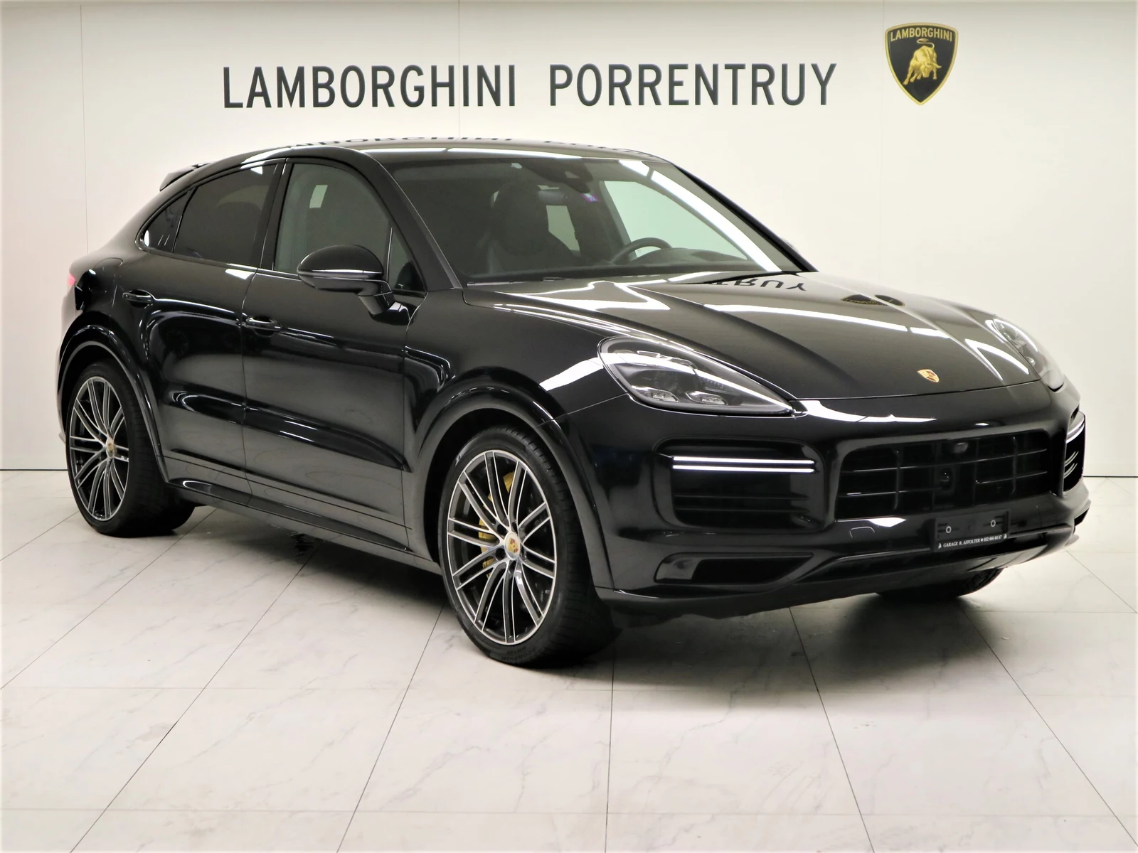 Black Porsche Cayenne Turbo S E-Hybrid Coupé, full front three-quarter view