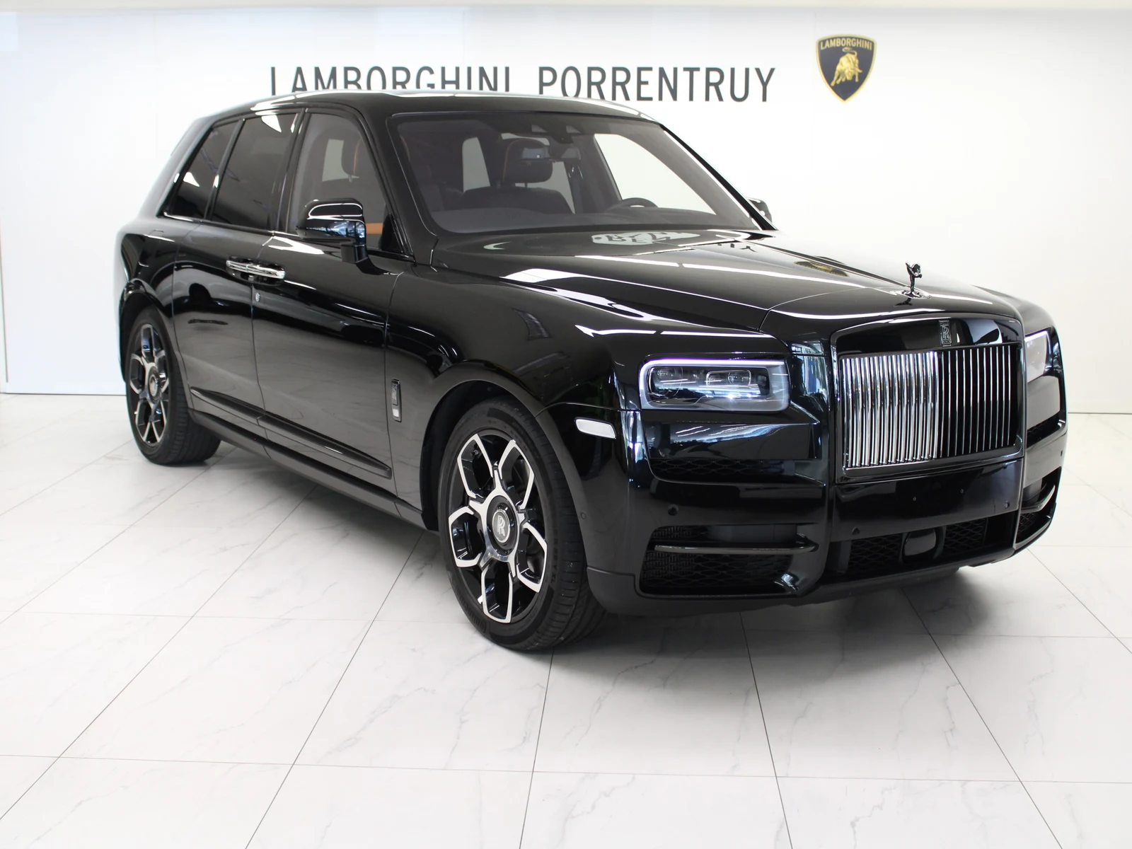 Black Rolls-Royce Cullinan Black Badge, full front three-quarter view