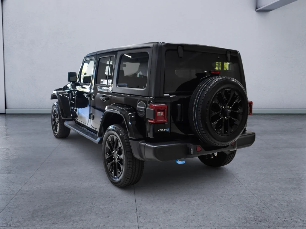 2024 Jeep Wrangler Sahara 4xe, rear three-quarter view, Black