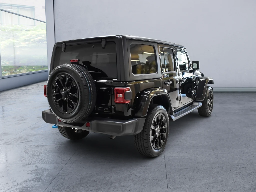 2024 Jeep Wrangler Sahara 4xe, rear three-quarter view, Black