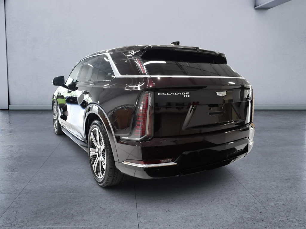 2025 Cadillac Escalade IQ Luxury 2, rear three-quarter view, Black