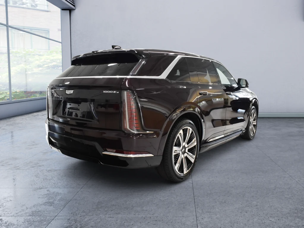 2025 Cadillac Escalade IQ Luxury 2, rear three-quarter view, Black