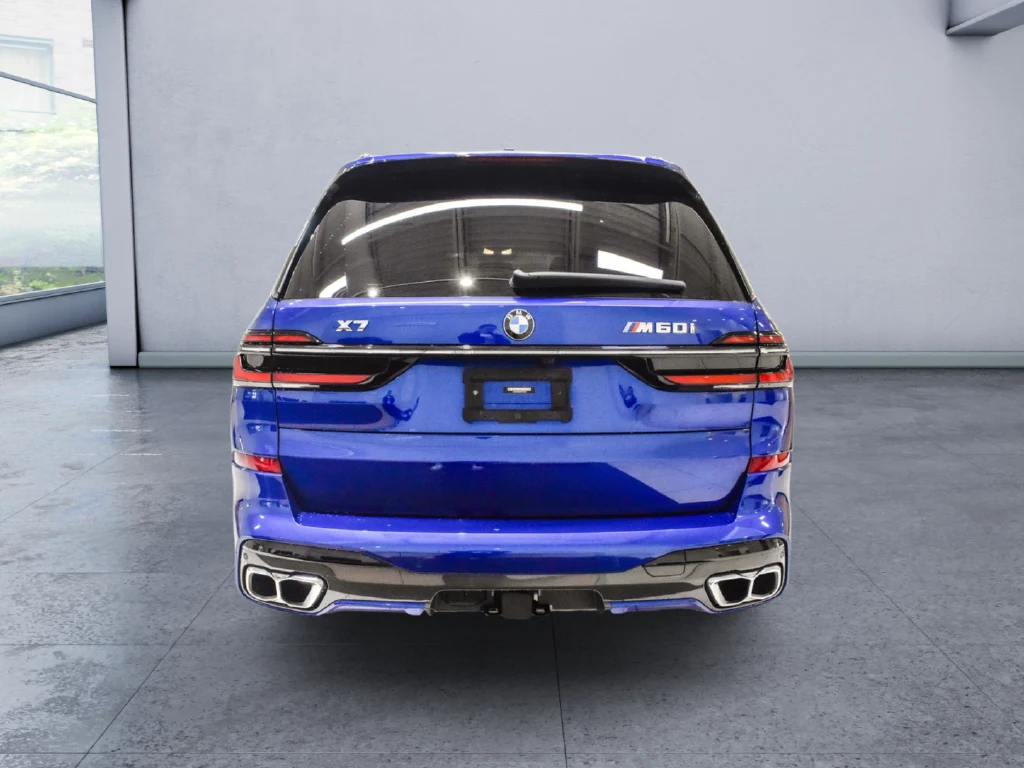 2023 BMW X7 M60i, rear three-quarter view, Blue