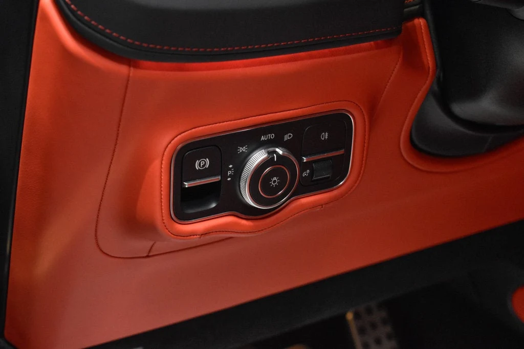 2025 Mercedes-AMG G 63 interior, center console, Red Pepper/Black