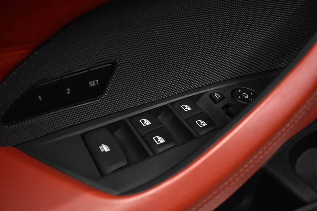 2024 BMW M4 Competition Convertible interior, center console, Fiona Red/Black