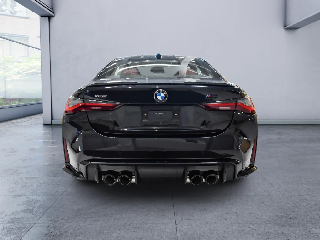 2024 BMW M4 Competition, rear three-quarter view, Black