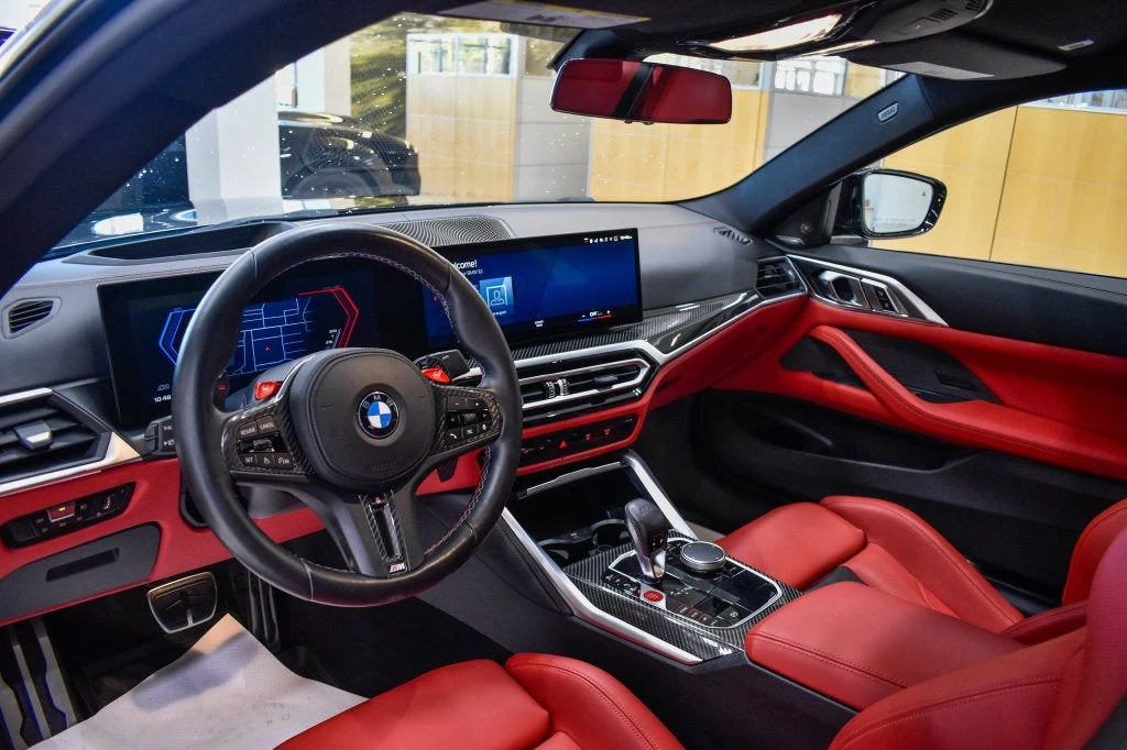 2024 BMW M4 Competition interior, dashboard, Fiona Red/Black