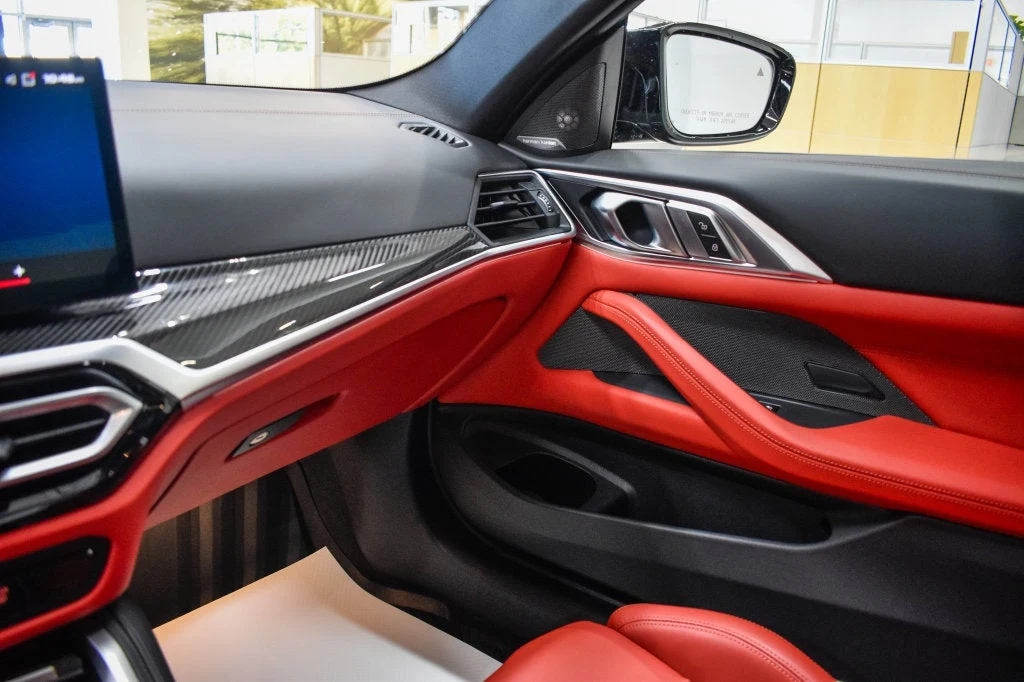2024 BMW M4 Competition interior, door panel, Fiona Red/Black