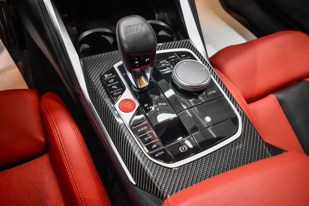 2024 BMW M4 Competition interior, center console, Fiona Red/Black