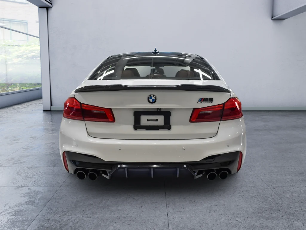 2019 BMW M5 Competition, rear three-quarter view, White