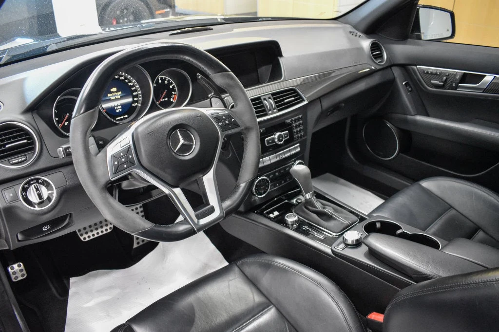 2013 Mercedes-Benz C 63 AMG Sedan interior, dashboard, Black