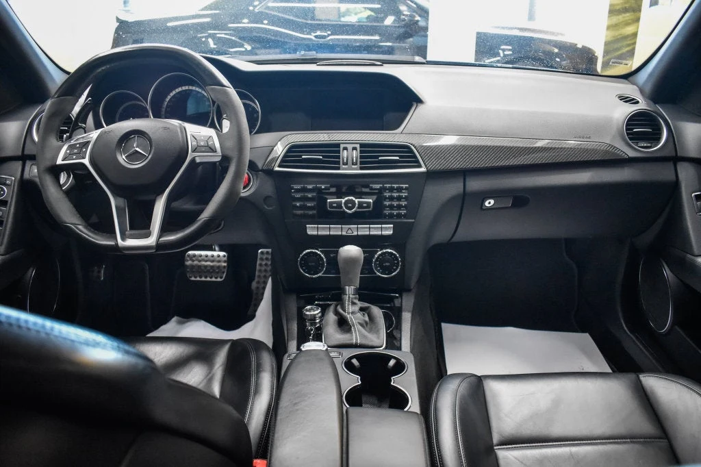 2013 Mercedes-Benz C 63 AMG Sedan interior, dashboard, Black