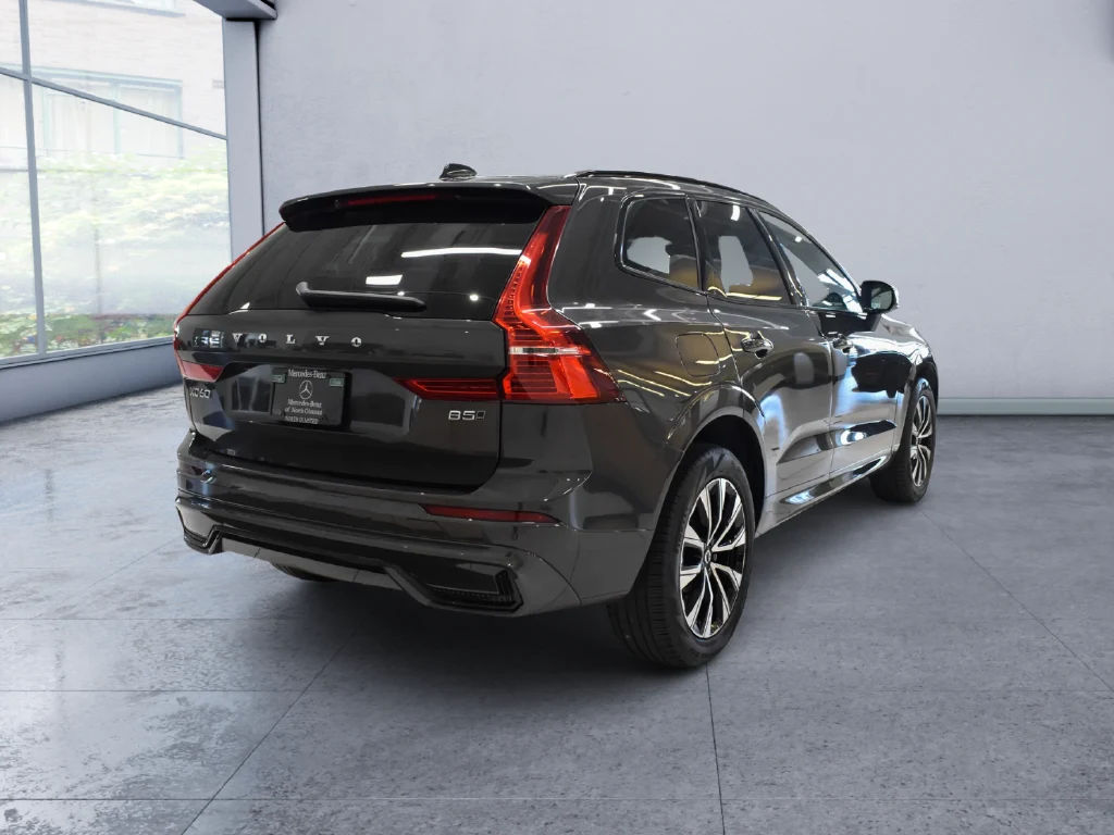 2024 Volvo XC60 B5 Core, rear three-quarter view, Grey