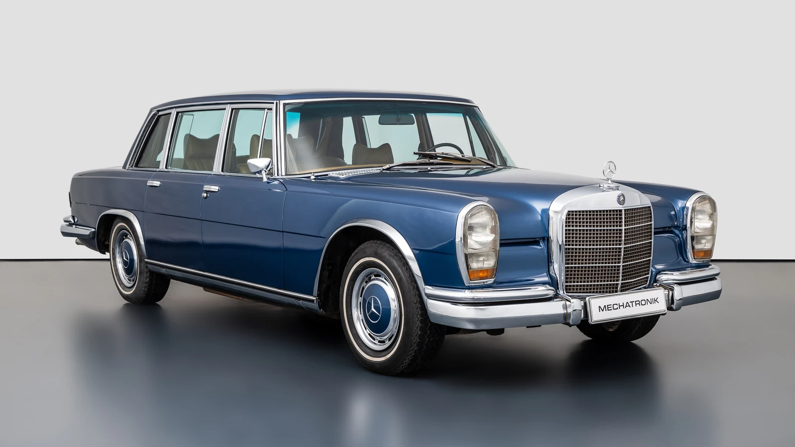 Blue metallic Mercedes-Benz 600, full front three-quarter view
