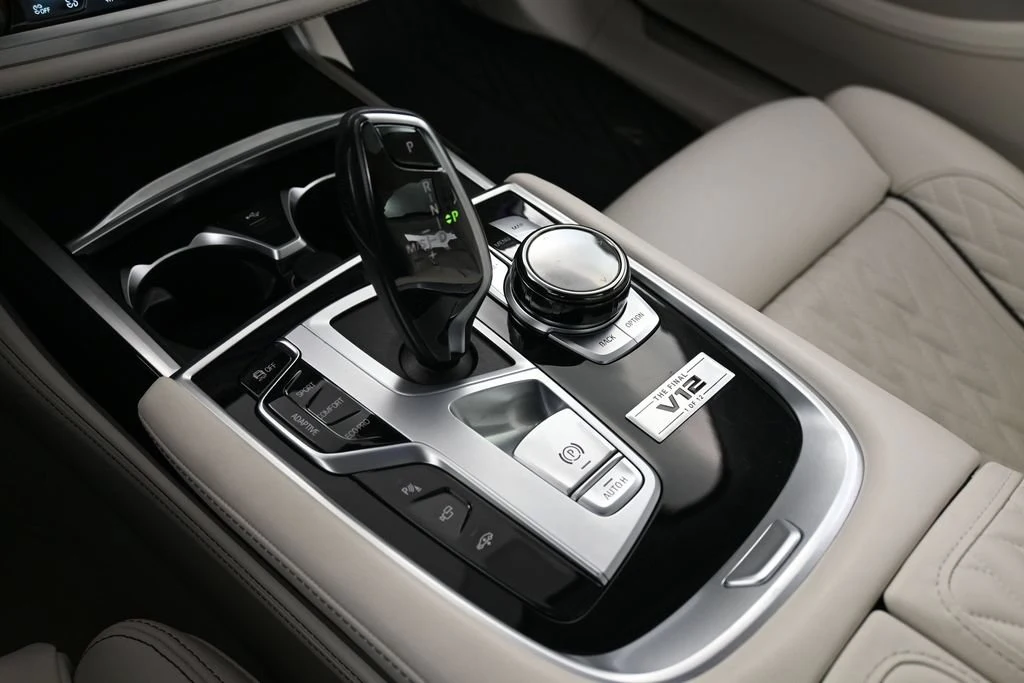 2022 BMW M760i xDrive interior, center console, Ivory White/Black