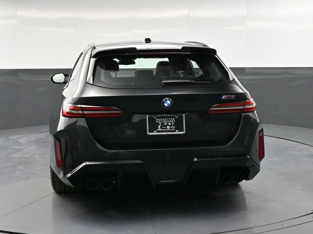 2025 BMW M5 Touring, rear three-quarter view, Blue