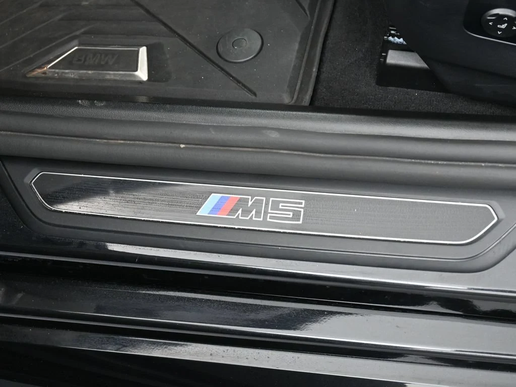 2025 BMW M5 Touring interior, door sill, Silver/Black Merino Leather