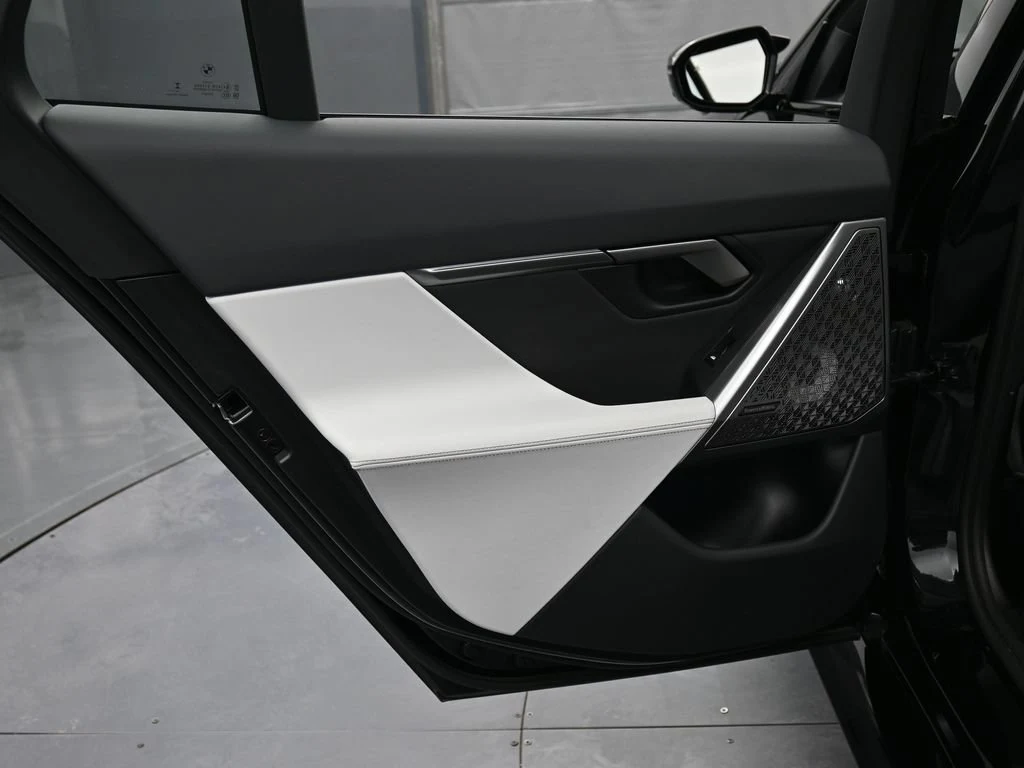 2025 BMW M5 Touring interior, door panel, Silver/Black Merino Leather