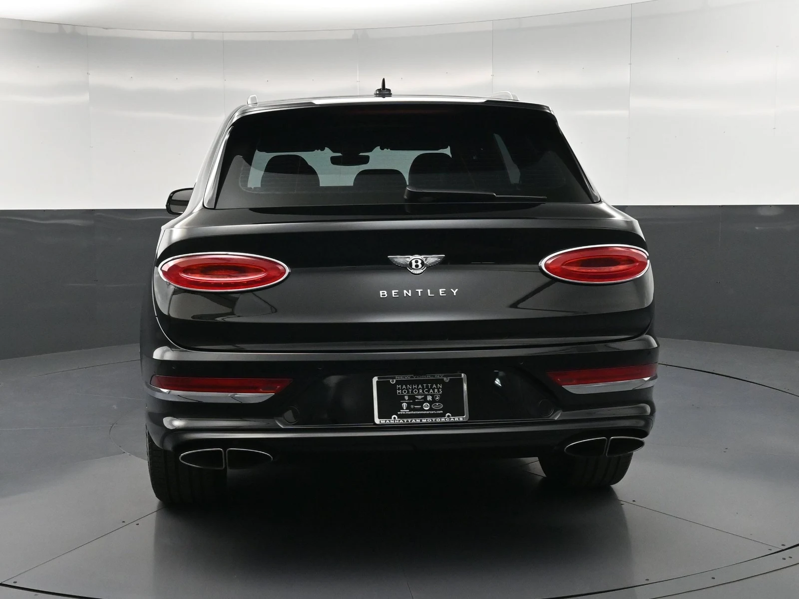 2024 Bentley Bentayga V8, rear three-quarter view, Black