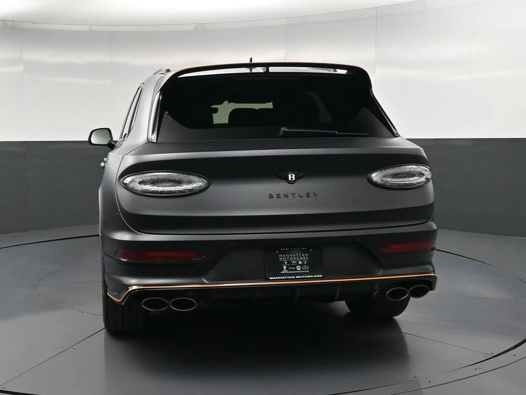 2026 Bentley Bentayga Speed, rear three-quarter view, Black