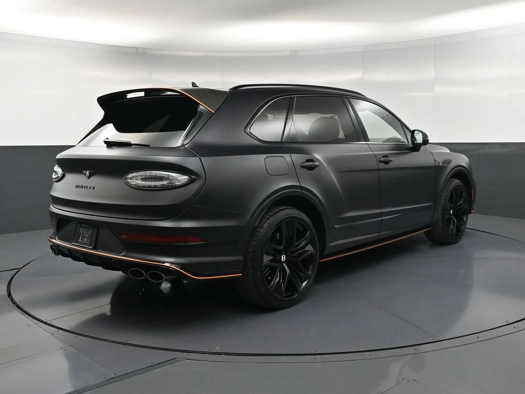 2026 Bentley Bentayga Speed, rear three-quarter view, Black