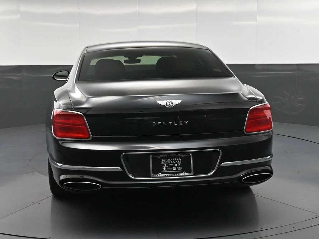 2020 Bentley Flying Spur W12, rear three-quarter view, Black