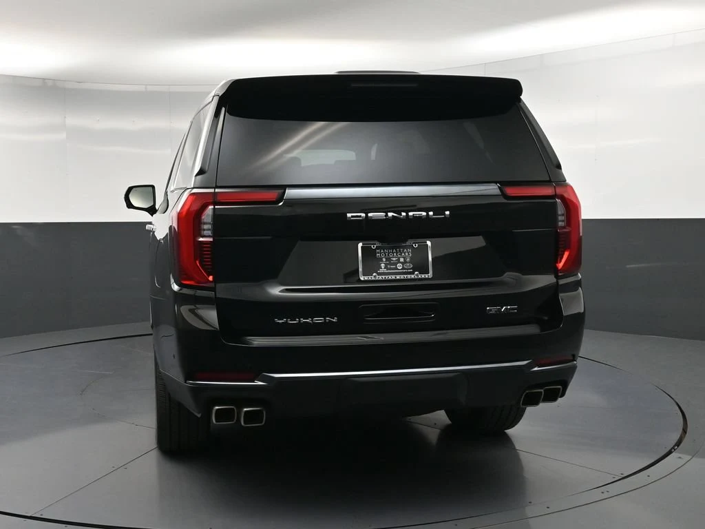 2026 GMC Yukon Denali Ultimate, rear three-quarter view, Black