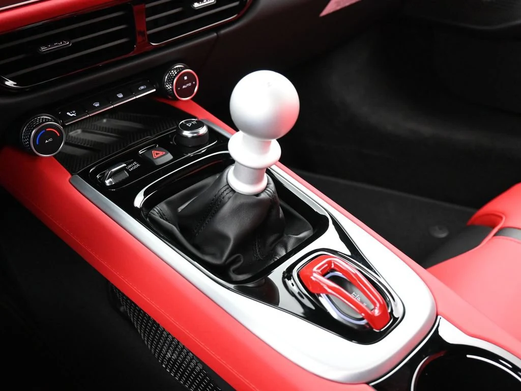 2025 Lotus Emira V6 interior, center console, Red Leather