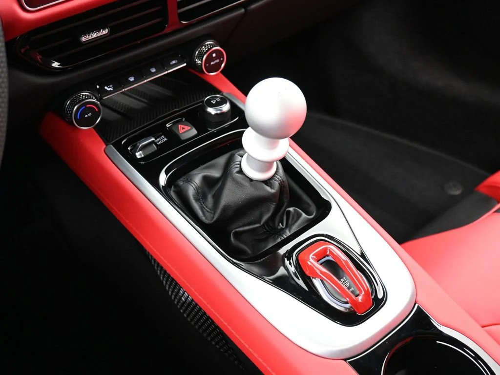 2025 Lotus Emira V6 interior, center console, Red Leather